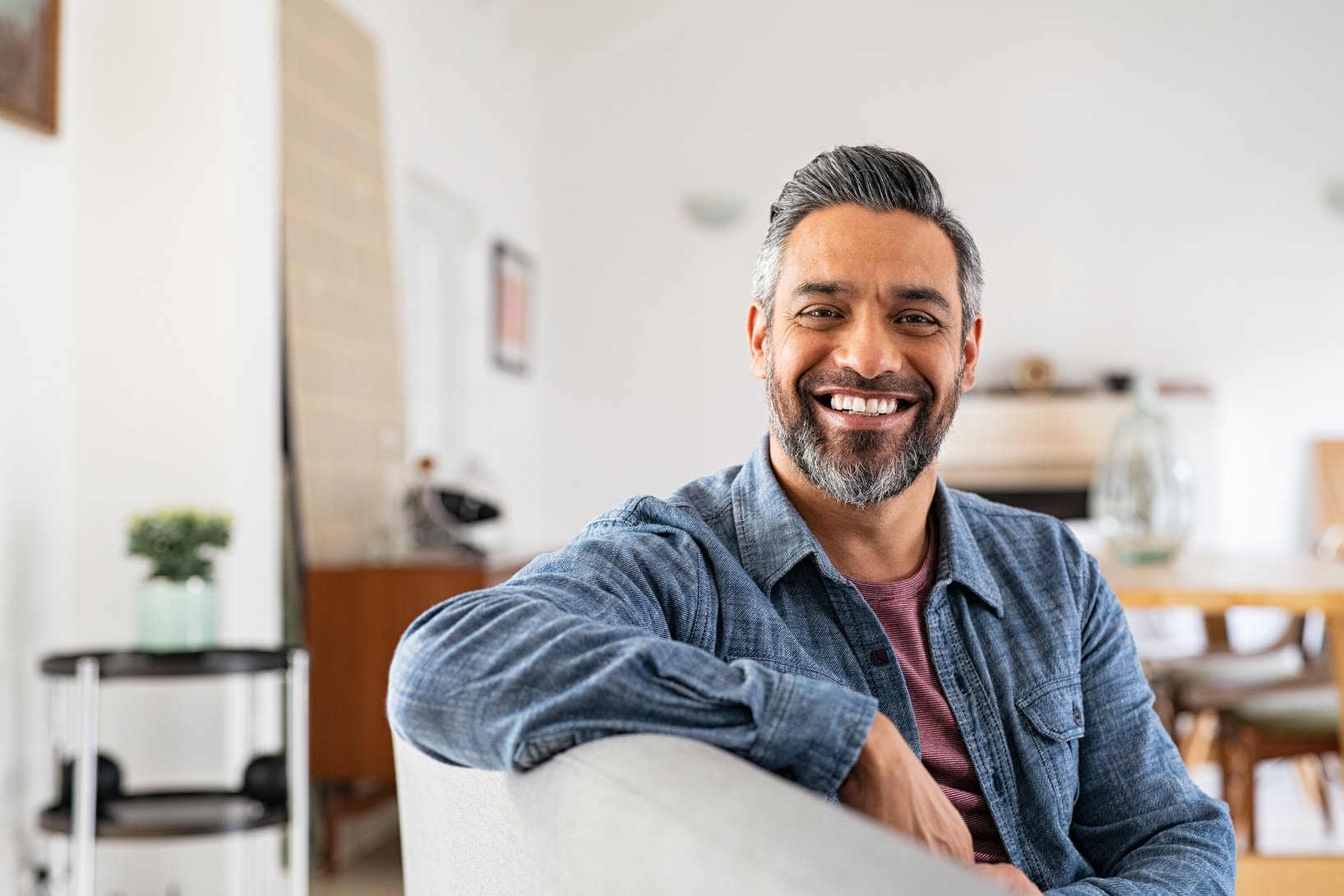 Smiling Man Relaxing on the Sofa 